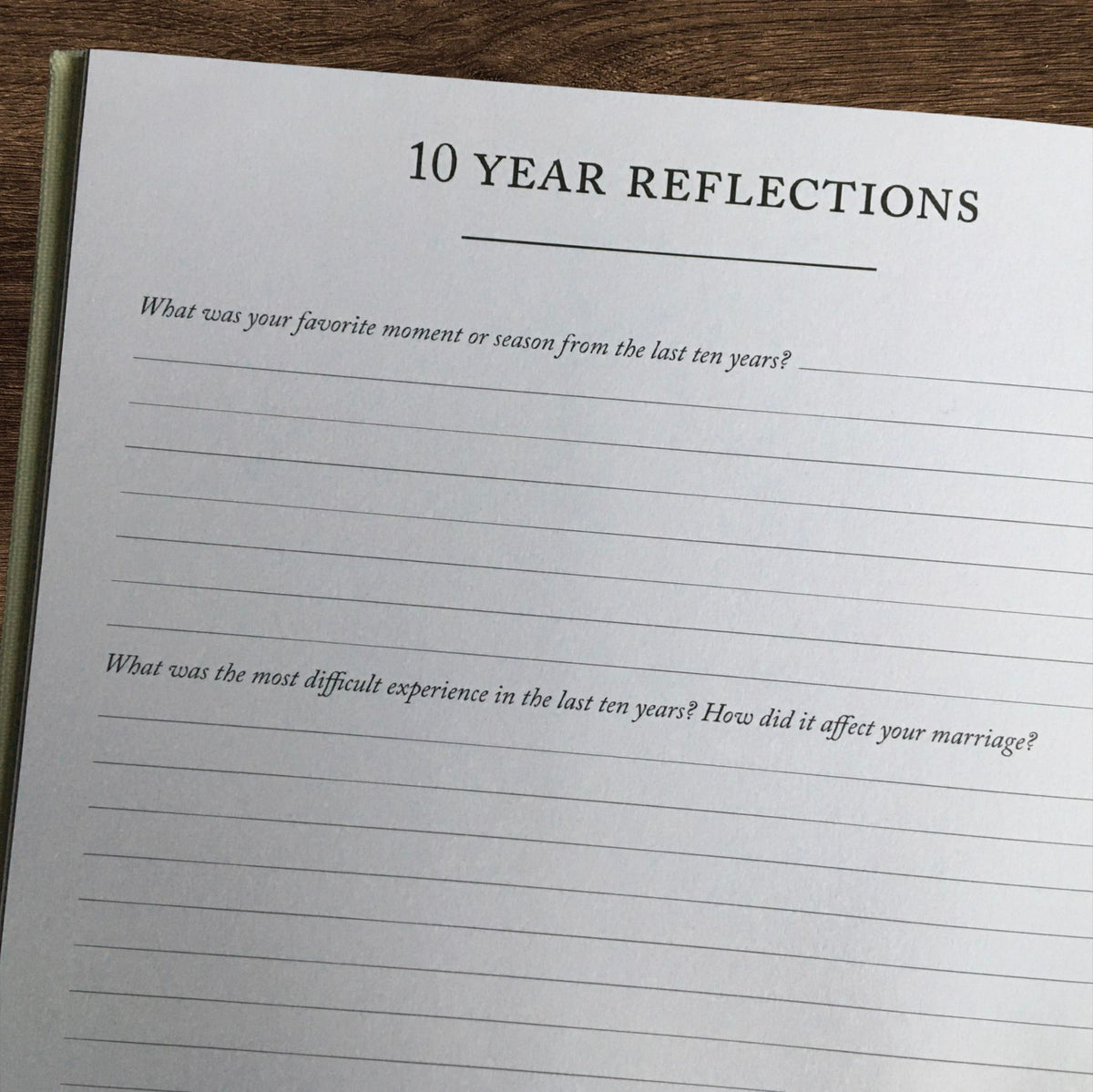 Heartfelt Gifts anniversary journal open to a page with handwritten reflections, celebrating 10 years of memories and love.